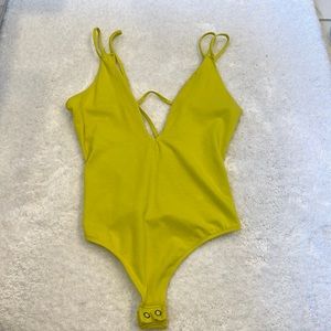 Express low cut neon yellow size small body suit